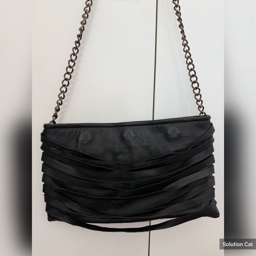 Black layered leather fringe bag with chain strap